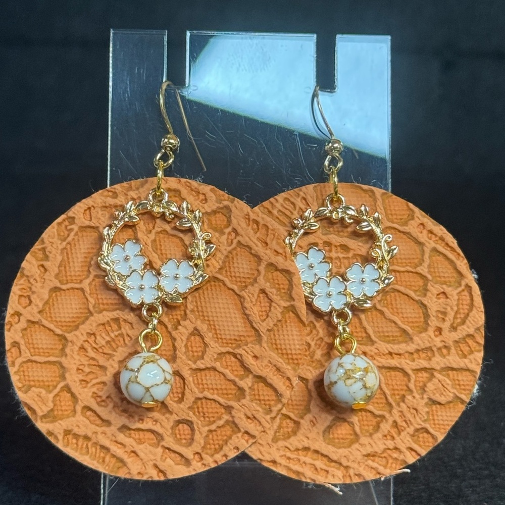 Elegant Orange Faux Leather Earrings with Gold and White Floral Charms